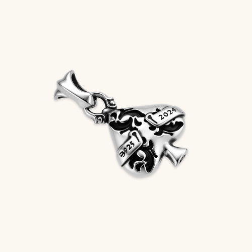925 sterling silver ace-of-spades pendant with oxidized floral engraving, gothic banner script, on a box chain.