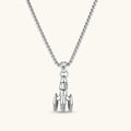 925 sterling silver rocket pendant with bullet-tip nose cone, ribbed boosters, and three fins on a box chain.