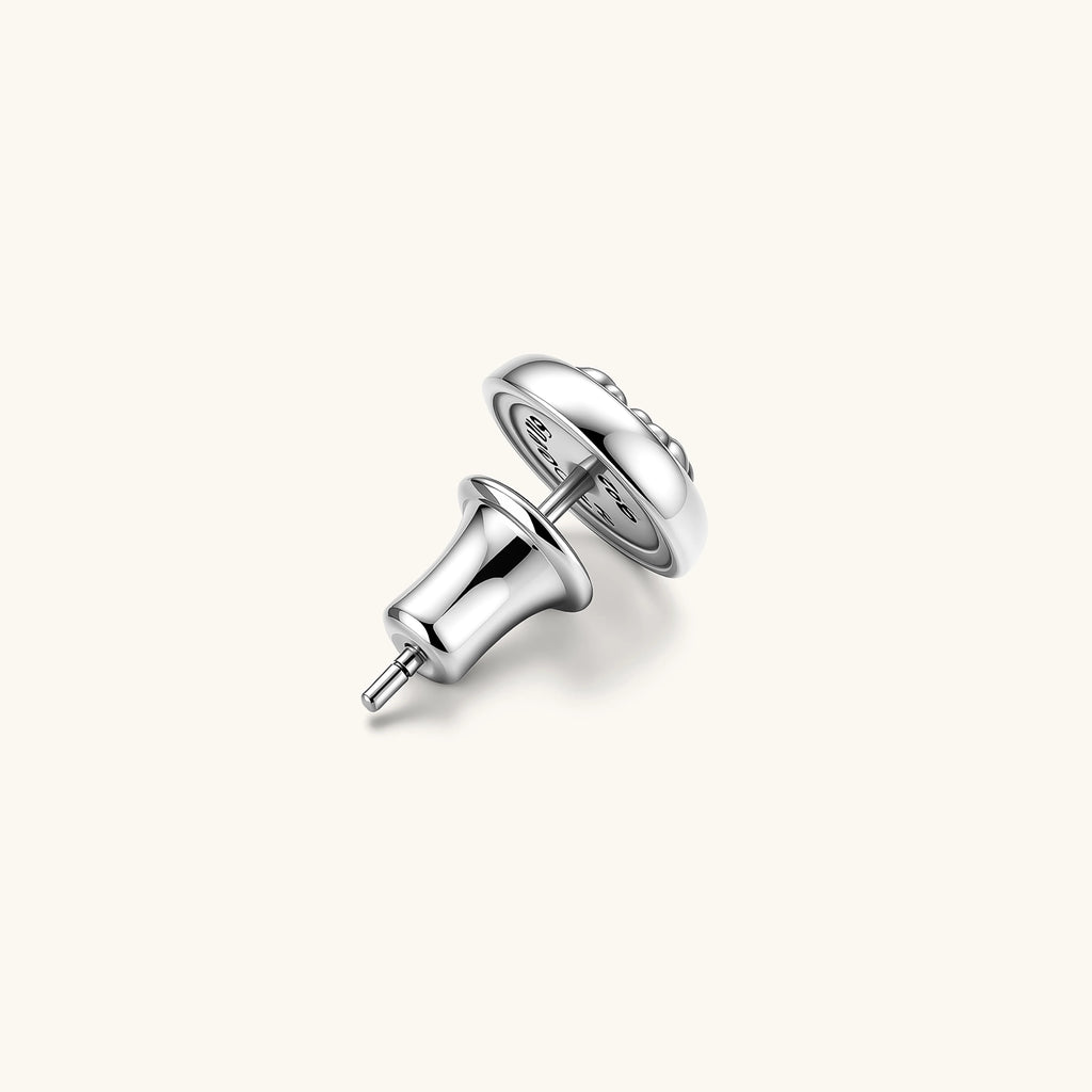 Round sterling silver stud earring with black enamel background and fleur-de-lis cross motif, butterfly push-back closure.