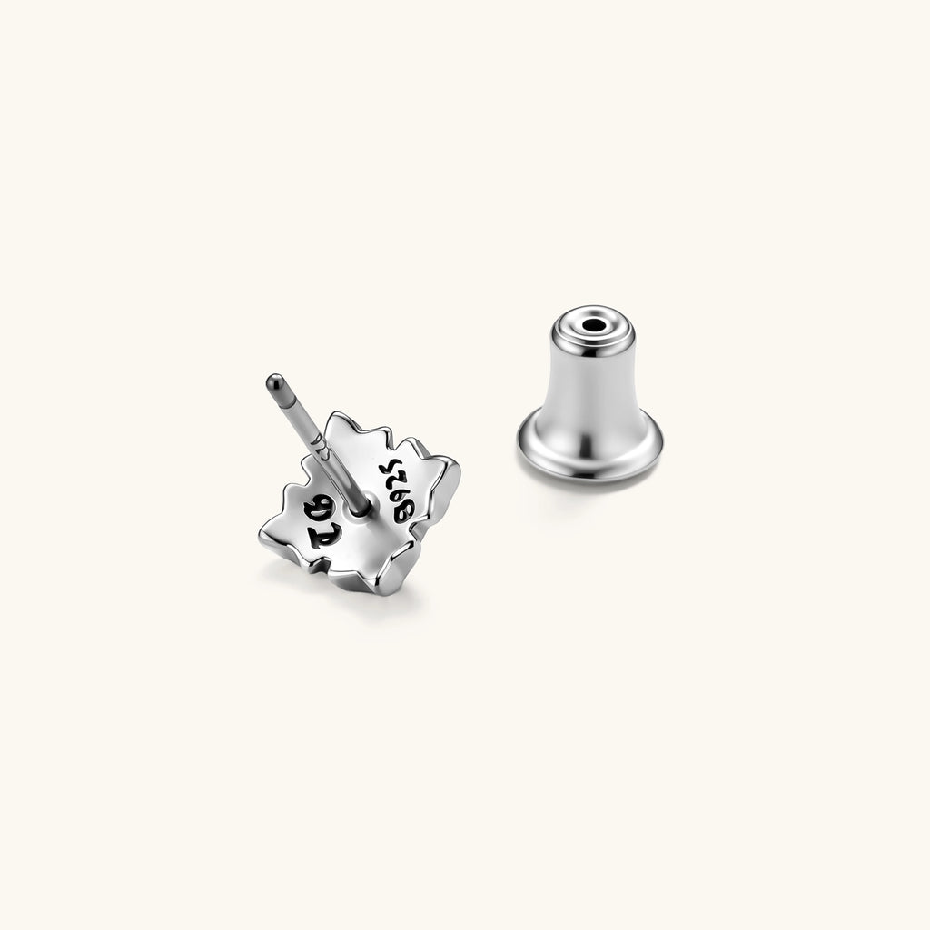 Front view of a 925 sterling silver gothic floral stud earring with oxidized petal detailing and a central dome bead.