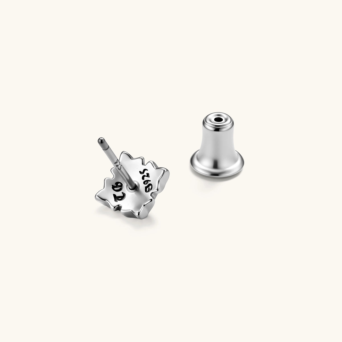 Front view of a 925 sterling silver gothic floral stud earring with oxidized petal detailing and a central dome bead.
