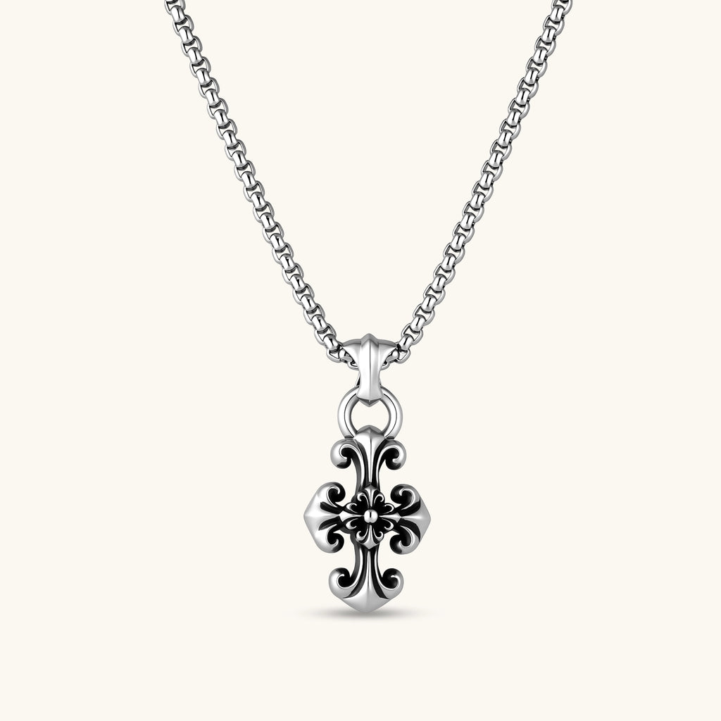 Sterling silver baroque floral cross pendant on a box chain, with oxidized black scrollwork detailing, 45mm length.