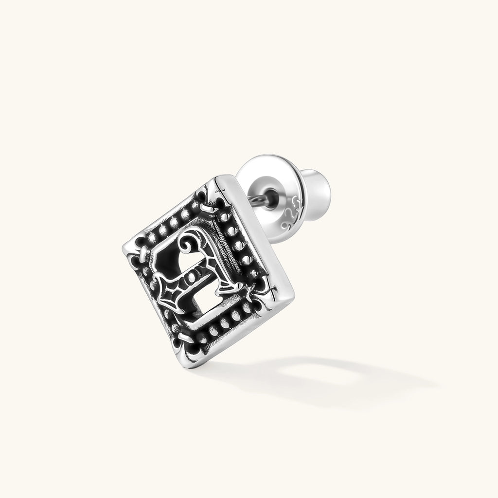 Square 925 sterling silver stud earring with oxidized Gothic letter, ornate dot border, fleur-de-lis corners, butterfly back.