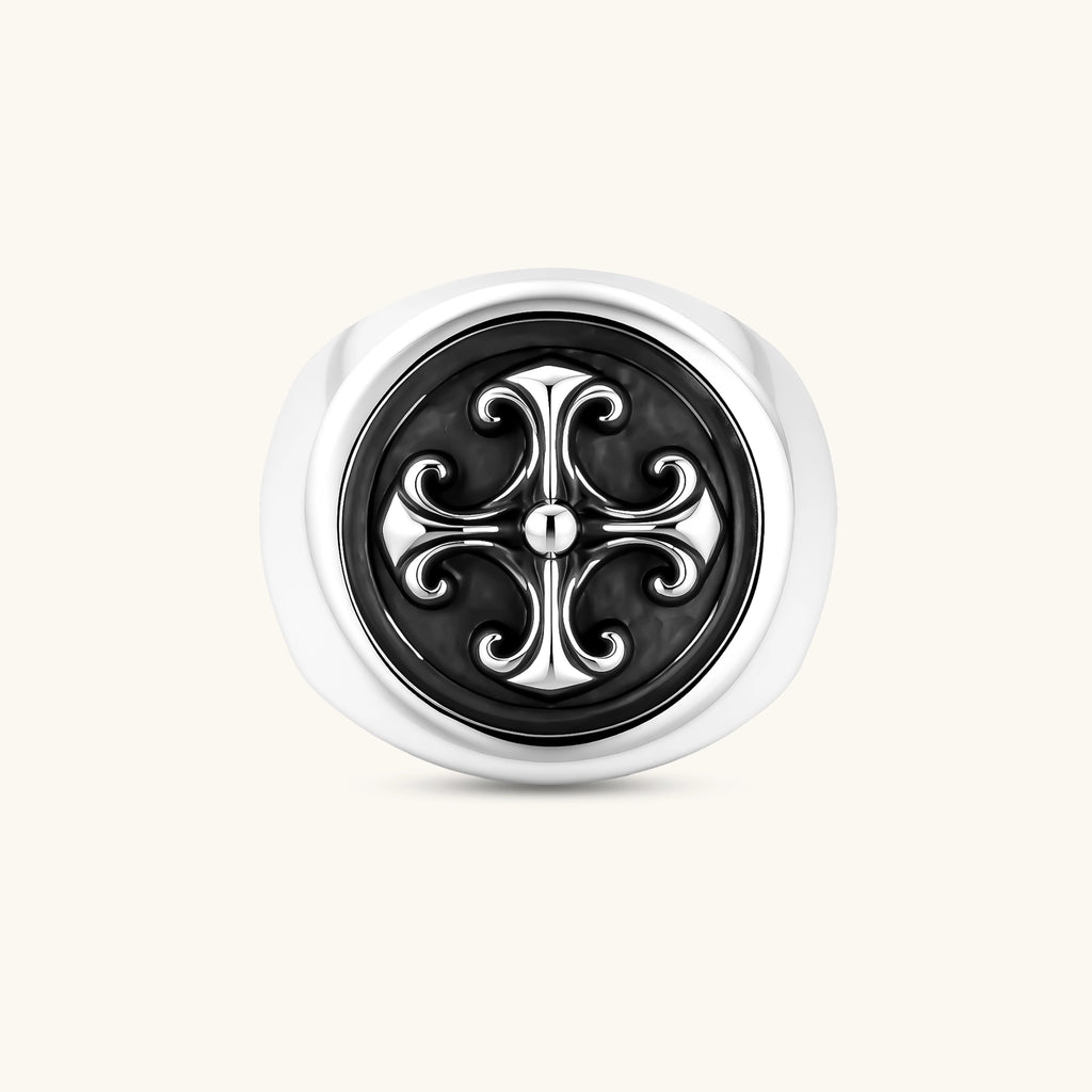 925 sterling silver open signet ring with dark oxidized fleur-de-lis cross motif on circular face, adjustable cuff band.
