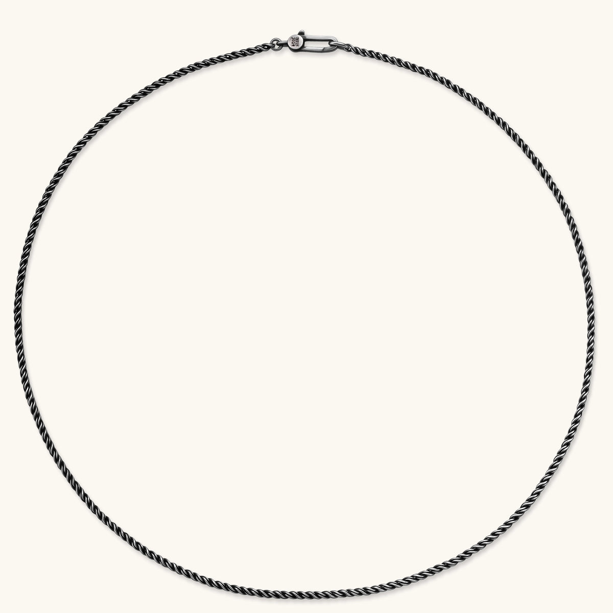 Oxidized 925 sterling silver rope chain necklace, 2.1mm width, carabiner clasp with brand stamp, on cream background.