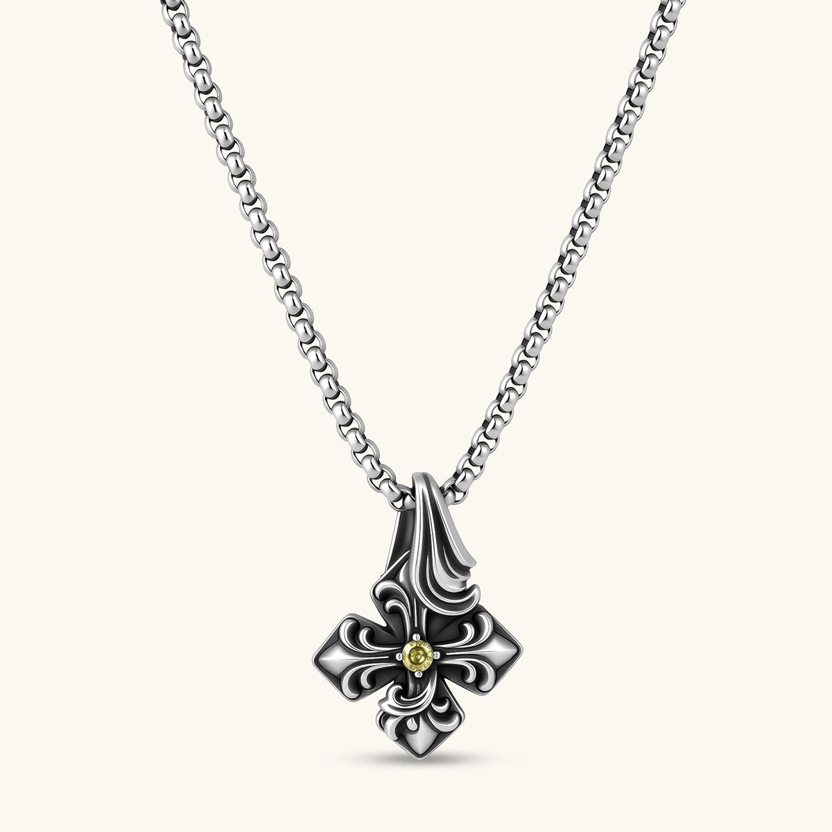 Sterling silver oxidized fleur-de-lis cross pendant with yellow gemstone center on a box chain, 36mm drop.