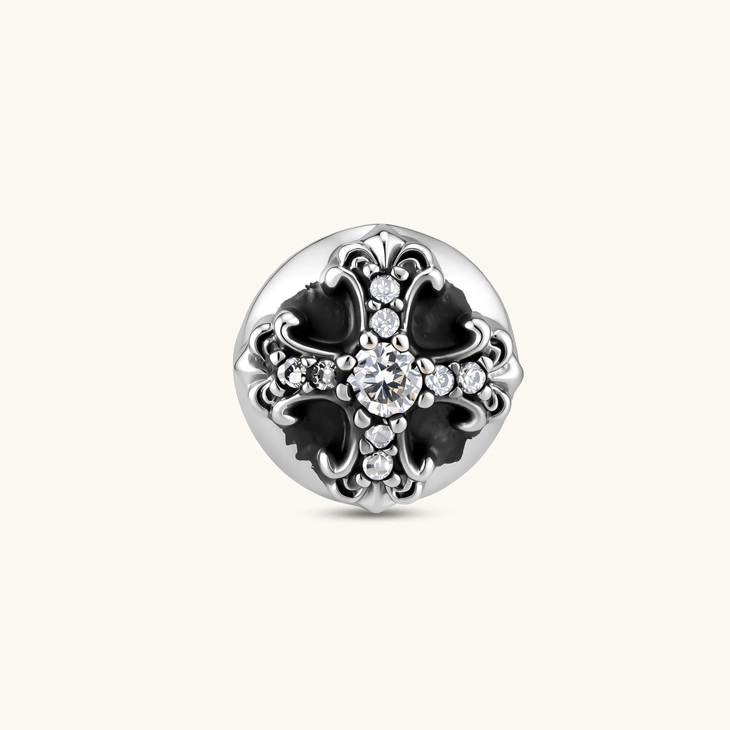 Sterling silver dome stud earring with oxidized black petals, ornate scrollwork, and clear cubic zirconia stones, butterfly back.