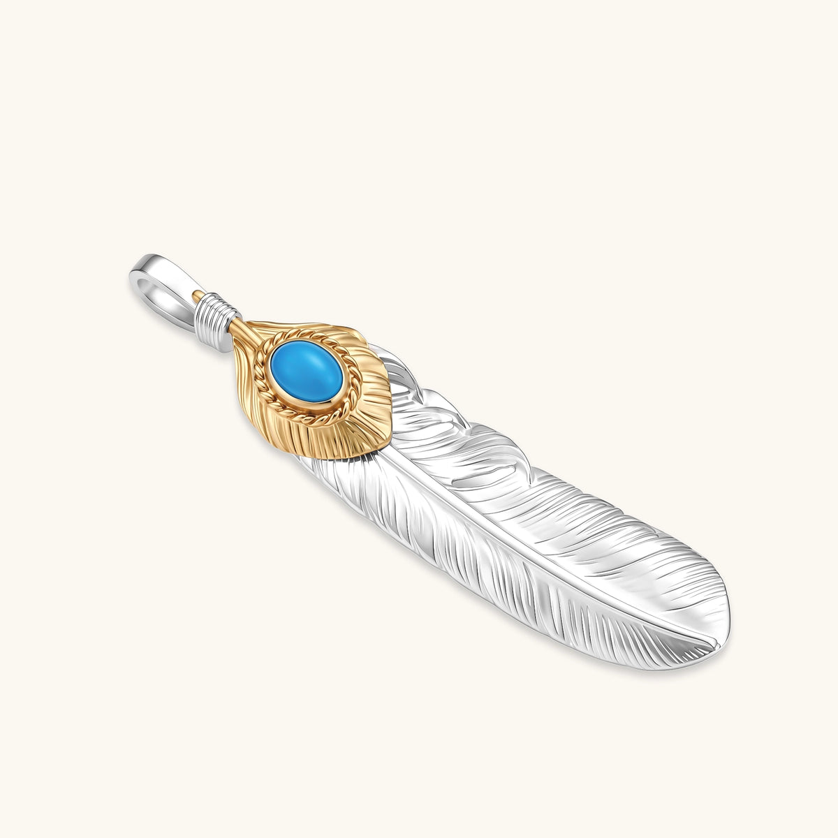 Sterling silver feather pendant with gold-tone base and oval turquoise cabochon, detailed quill engraving, 67mm length.