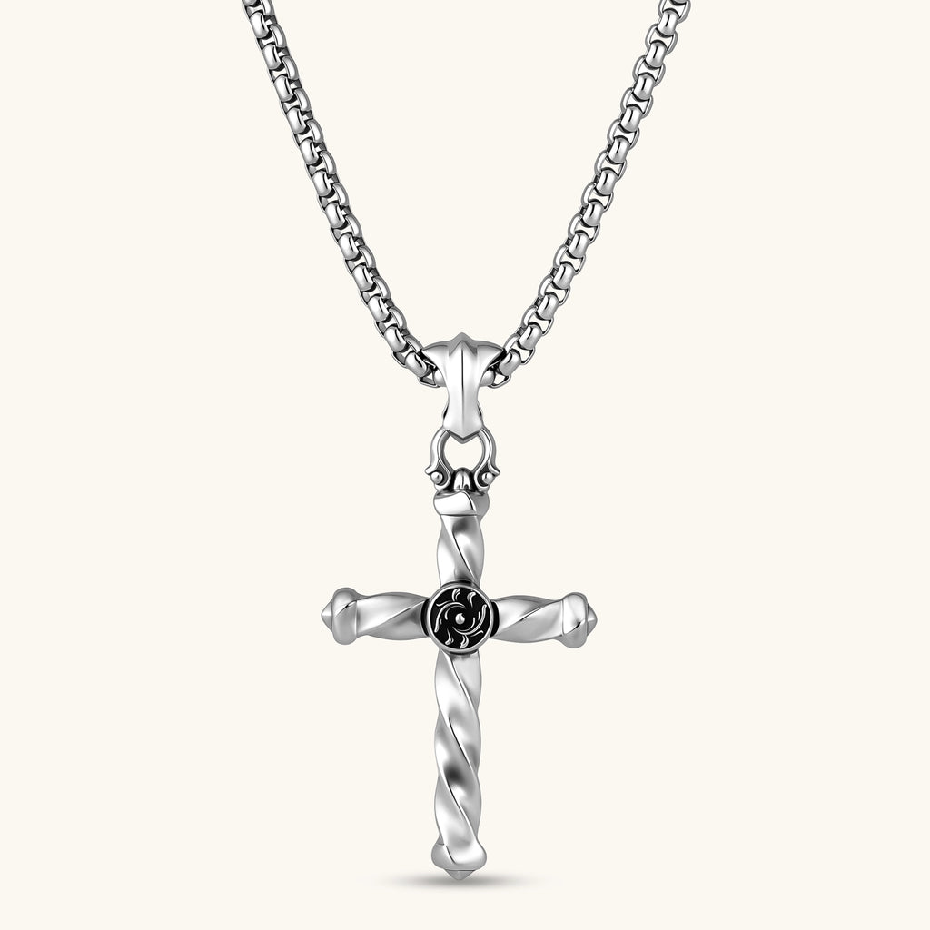 925 sterling silver twisted cross pendant with black enamel sun motif center, on a box chain, cream background.