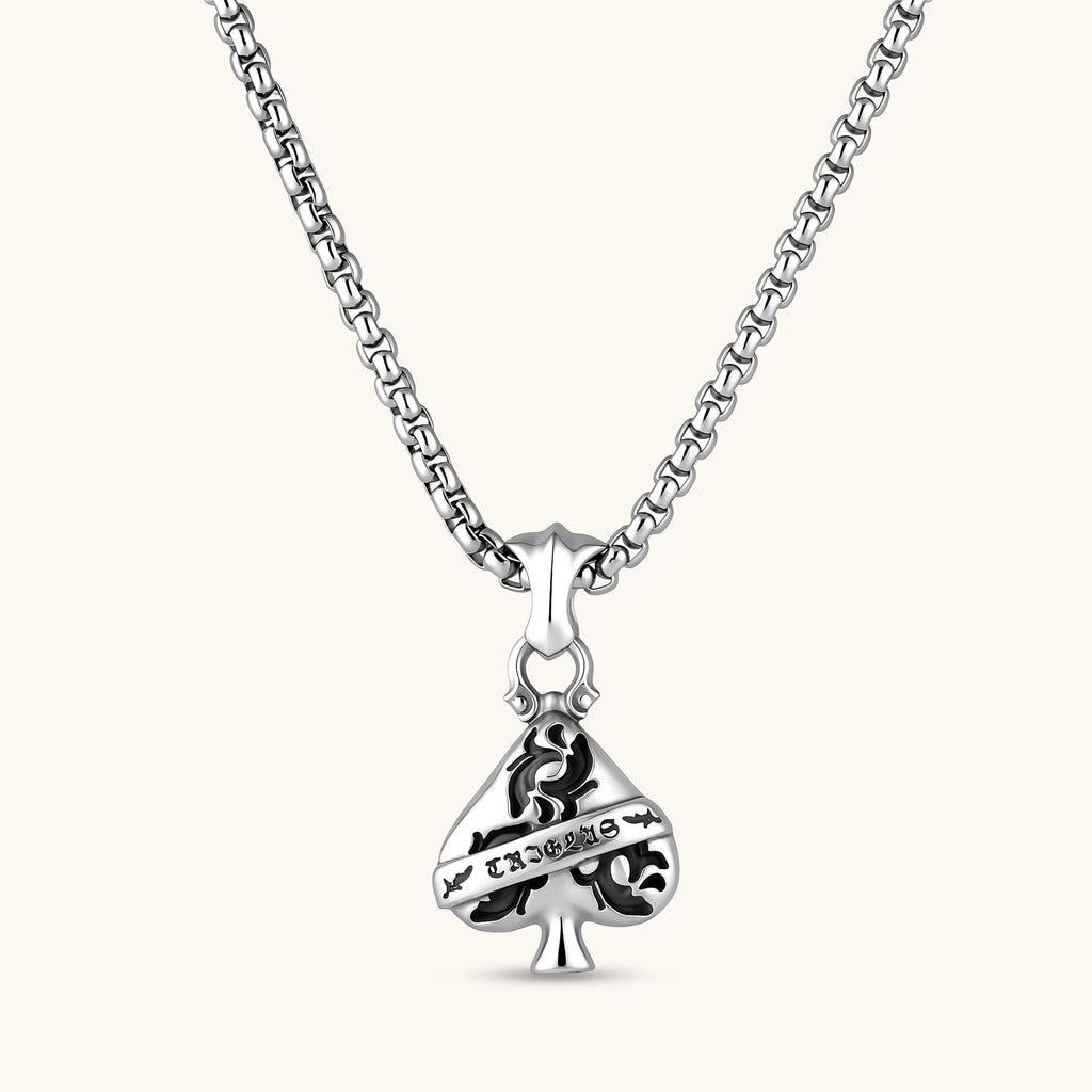 925 sterling silver ace-of-spades pendant with oxidized floral engraving, gothic banner script, on a box chain.