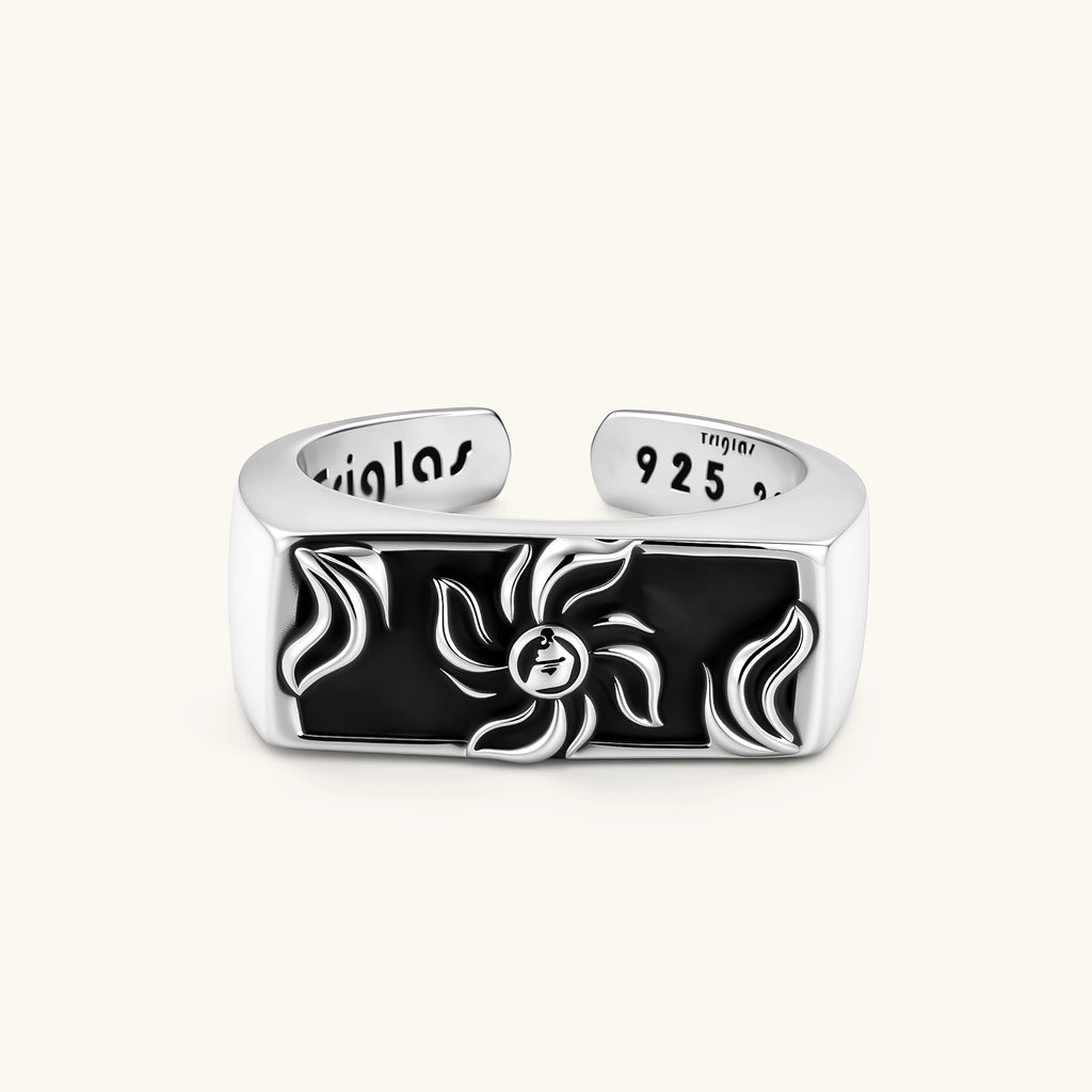 925 sterling silver open signet ring with rectangular black enamel face and raised silver sun-spider motif, adjustable band.