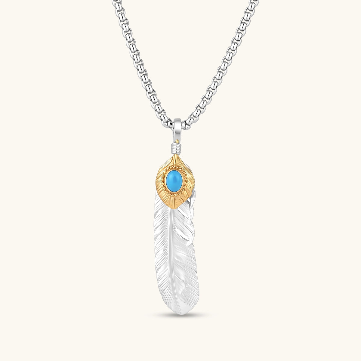 Sterling silver feather pendant with gold-tone base and oval turquoise cabochon, detailed quill engraving, 67mm length.
