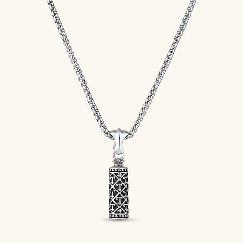Sterling silver cylindrical pendant with black oxidized anchor lattice pattern on a box chain, 40mm length.