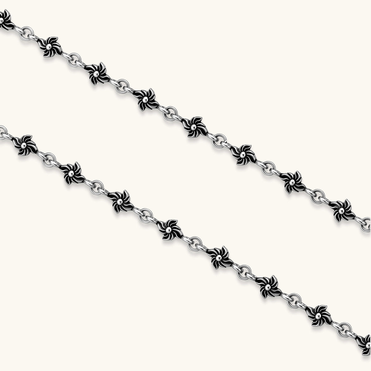 Sterling silver necklace with ornate floral-link chain, ring clasp, cross toggle bar, and Gothic fleur cross pendant.
