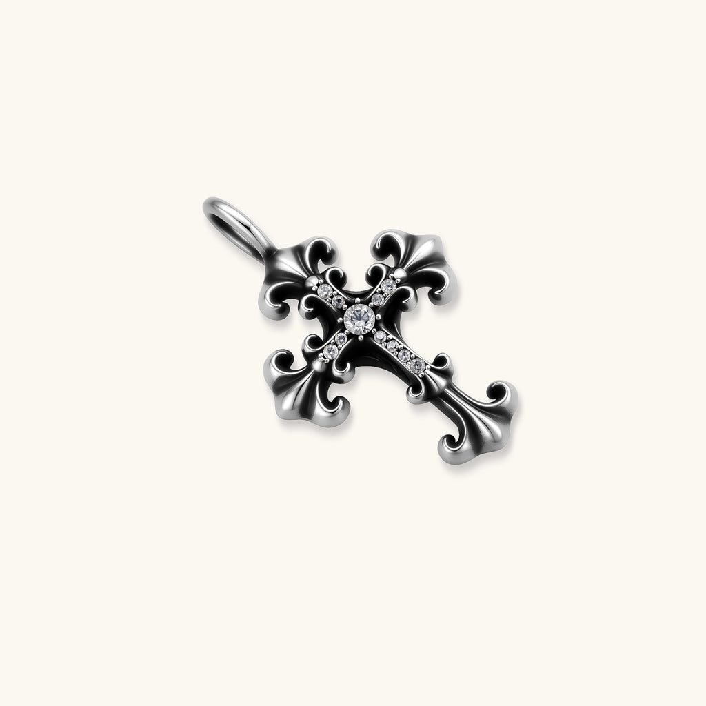 Ornate oxidized sterling silver gothic cross pendant with fleur-de-lis tips and pavé crystal accents on a box chain.