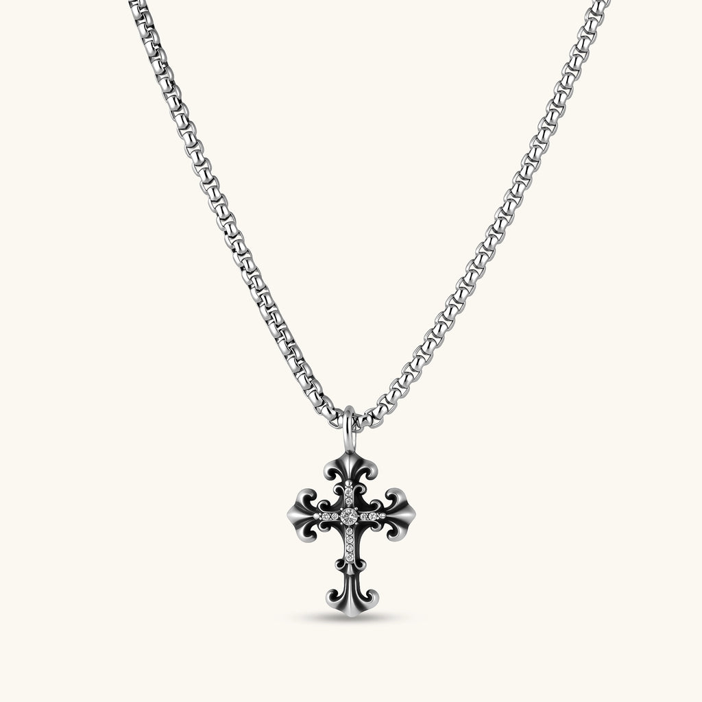 Ornate oxidized sterling silver gothic cross pendant with fleur-de-lis tips and pavé crystal accents on a box chain.
